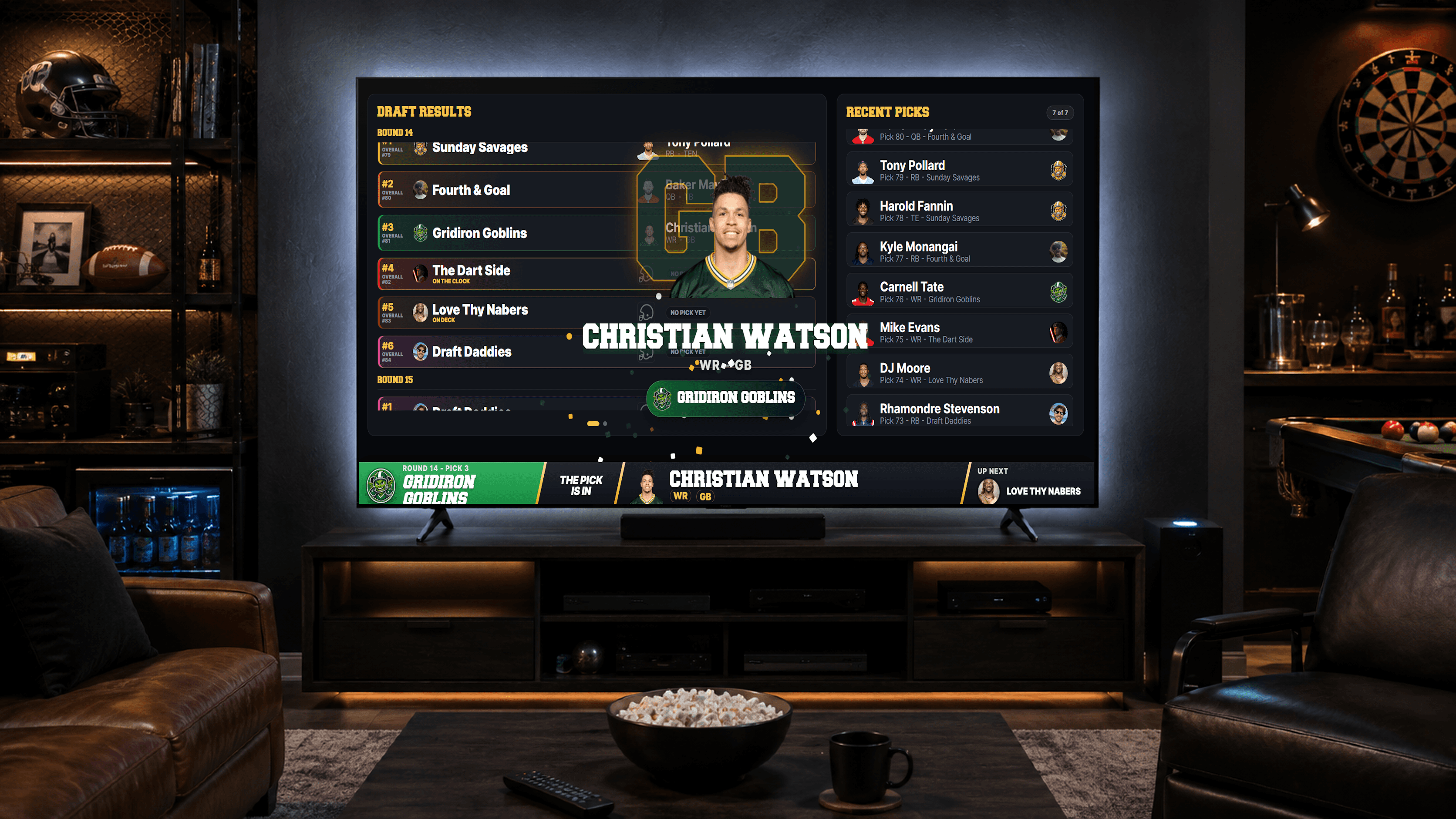 A living room set up for draft night — DRAFTNIGHT's live broadcast board on the big TV, leather chairs, popcorn, and drinks